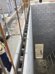 Masonry wall with reinforcing steel prior to grouting