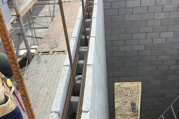 Masonry wall with reinforcing steel prior to grouting