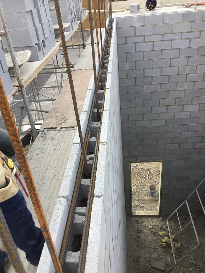 Masonry wall with reinforcing steel prior to grouting