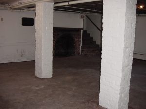 Interior masonry fireplace structure at Hanover Tavern during renovation work.