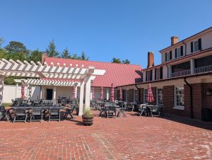 Outdoor courtyard and pergola gathering space at Hanover Tavern.