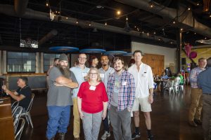 Six attendees pose for a group photo at Zannino Engineering’s 35th anniversary celebration at River City Roll.